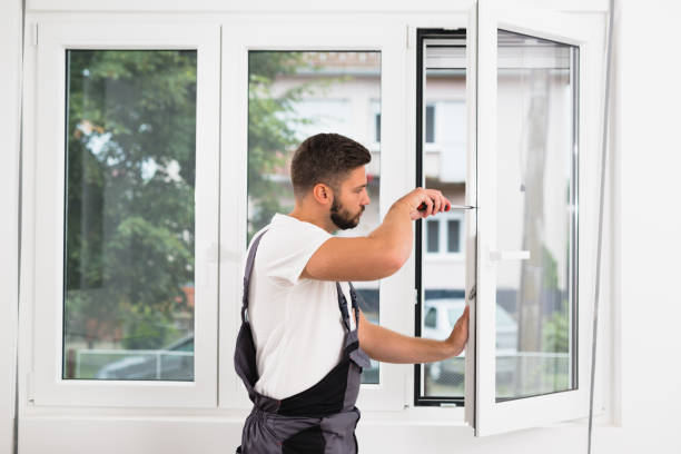 worker fixing pvc windows indoor