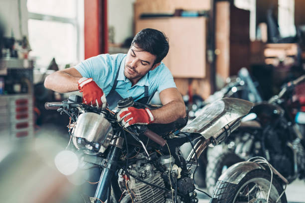 Mechanic repairing a motorcycle