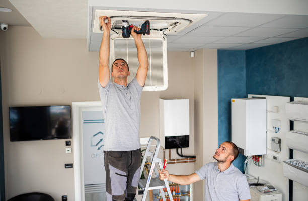 workers install air conditioning workers